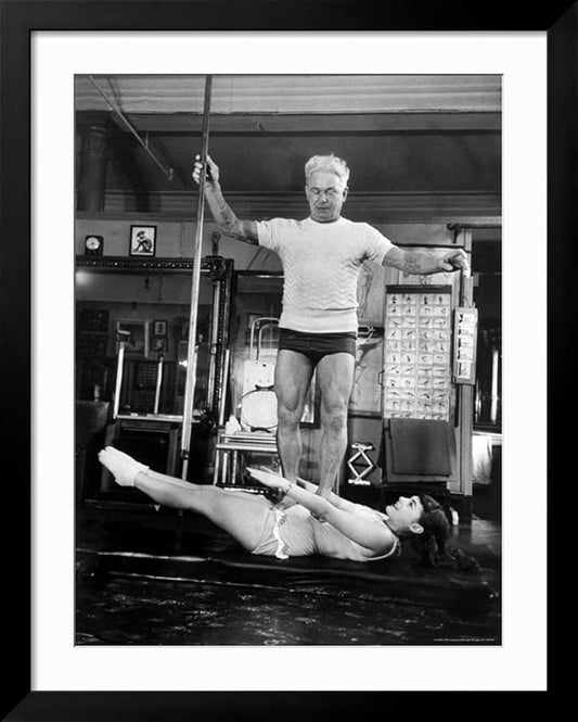 ART.COM Wall Premium Photographic Print Opera Singer Roberta Peters Balancing Her Trainer, Joseph Pilates, on Her Operatic Breadbasket on Black Frame by Michael Rougier, 32" x 40"