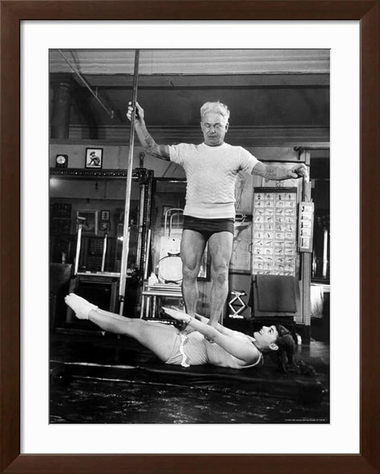 ART.COM Wall Premium Photographic Print Opera Singer Roberta Peters Balancing Her Trainer, Joseph Pilates, on Her Operatic Breadbasket on Brown Frame by Michael Rougier, 32" x 40"