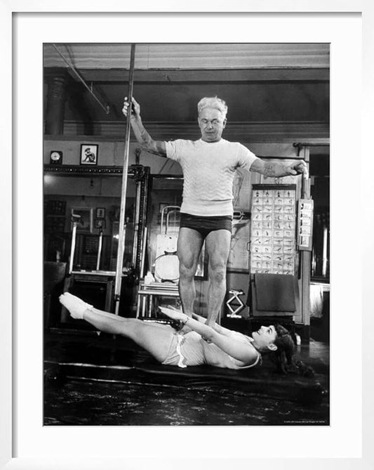 ART.COM Wall Premium Photographic Print Opera Singer Roberta Peters Balancing Her Trainer, Joseph Pilates, on Her Operatic Breadbasket on White Frame by Michael Rougier, 23" x 29"