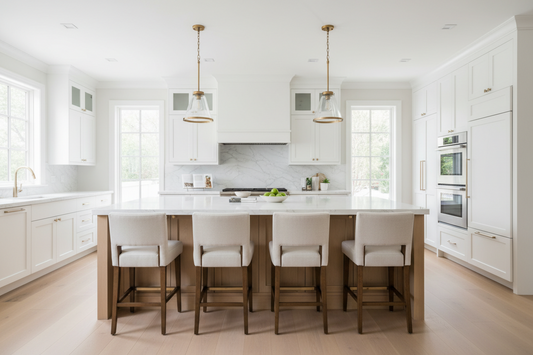 Modern kitchen island with properly sized bar stools in a bright contemporary home