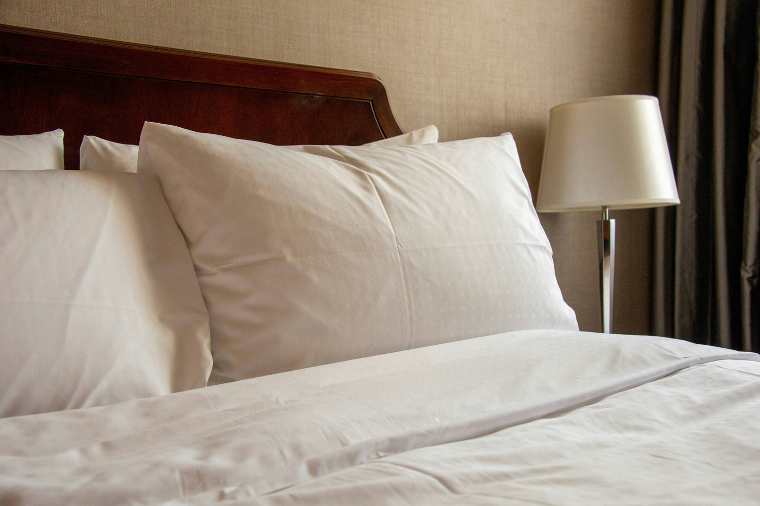 Soft bed pillows arranged on a cozy bed