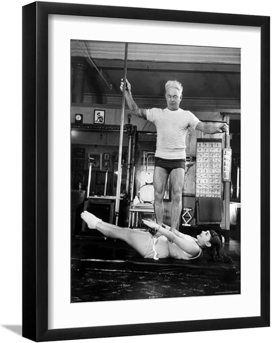 ART.COM Wall Premium Photographic Print Opera Singer Roberta Peters Balancing Her Trainer, Joseph Pilates, on Her Operatic Breadbasket on Black Frame by Michael Rougier, 17" x 21"