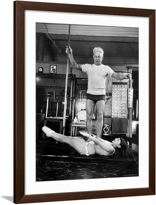 ART.COM Wall Premium Photographic Print Opera Singer Roberta Peters Balancing Her Trainer, Joseph Pilates, on Her Operatic Breadbasket on Brown Frame by Michael Rougier, 32" x 40"