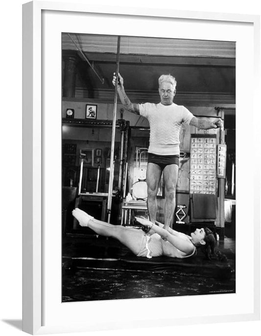 ART.COM Wall Premium Photographic Print Opera Singer Roberta Peters Balancing Her Trainer, Joseph Pilates, on Her Operatic Breadbasket on White Frame by Michael Rougier, 23" x 29"