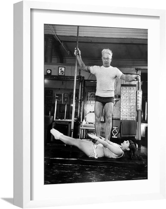 ART.COM Wall Premium Photographic Print Opera Singer Roberta Peters Balancing Her Trainer, Joseph Pilates, on Her Operatic Breadbasket on White Frame by Michael Rougier, 17" x 21"