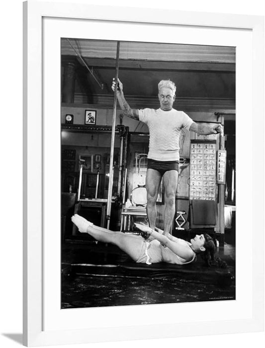 ART.COM Wall Premium Photographic Print Opera Singer Roberta Peters Balancing Her Trainer, Joseph Pilates, on Her Operatic Breadbasket on White Frame by Michael Rougier, 32" x 40"