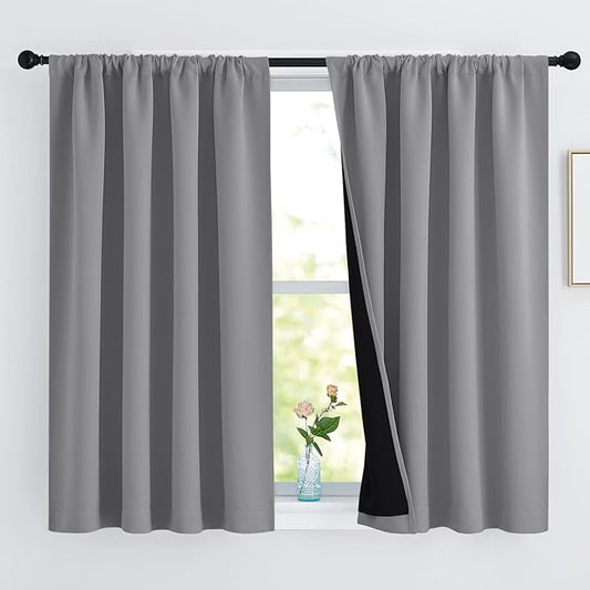 NICETOWN 100% Blackout Curtains with Black Liners, Thermal Insulated Rod Pocket Full Blackout 2-Layer Lined Drapes, Noise Reducing Window Draperies for Nursery (Silver Gray, 2 Panels, 52 W by 54 L)