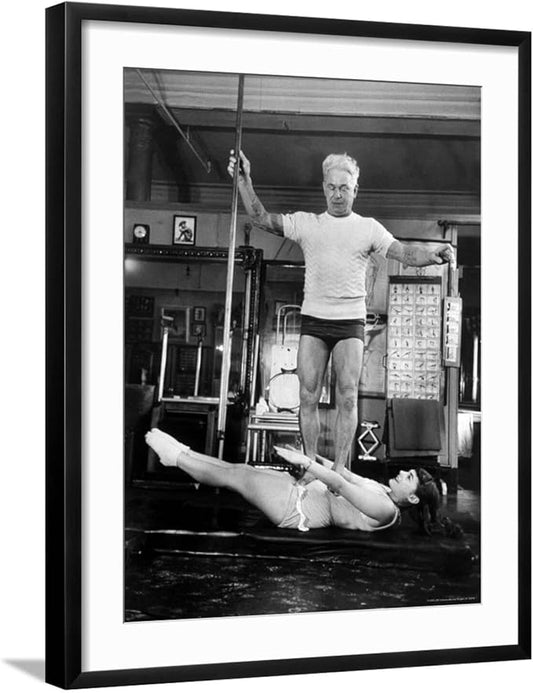 ART.COM Wall Premium Photographic Print Opera Singer Roberta Peters Balancing Her Trainer, Joseph Pilates, on Her Operatic Breadbasket on Black Frame by Michael Rougier, 23" x 29"