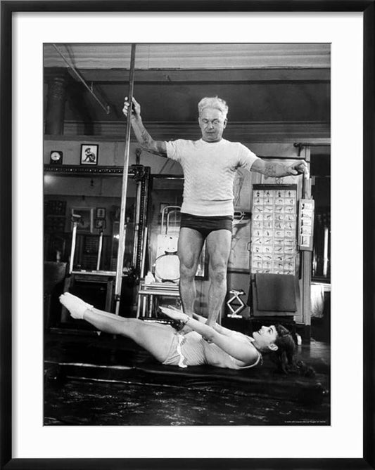 ART.COM Wall Premium Photographic Print Opera Singer Roberta Peters Balancing Her Trainer, Joseph Pilates, on Her Operatic Breadbasket on Black Frame by Michael Rougier, 23" x 29"