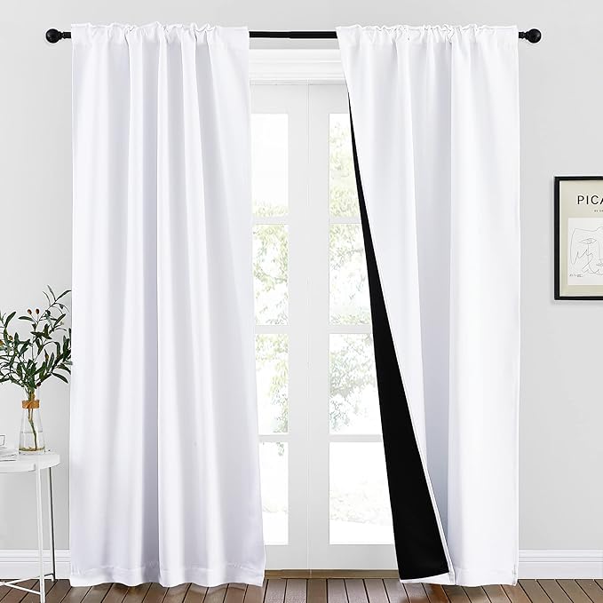 NICETOWN 100% Blackout Window Curtains, Cold and Full Light Blocking Drapes with Black Liner for Nursery, 95 Inches Thermal Insulated Draperies for Patio Door (Pure White, 2 Pieces, 70 inches Wide)